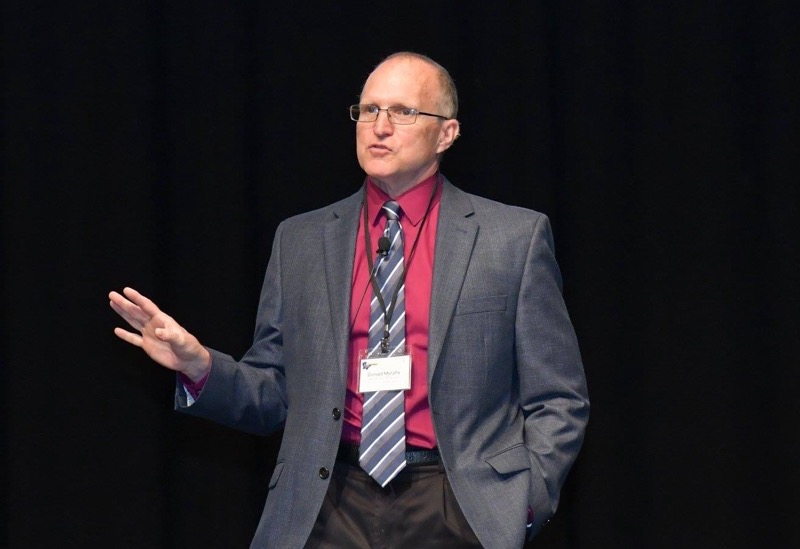Dr. Murphy speaking at a conference